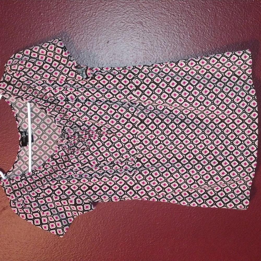 Work top, with brown, pink, orange and white print.